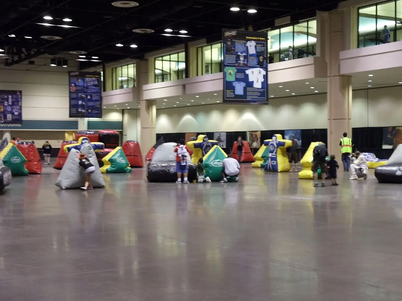 An inflatable laser tag arena set up in an exhibition hall